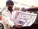 Newspaper vendor in Karachi, Feb25, 2009 "Nawaz Sharif disqualified" reads the headline