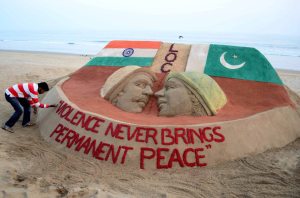 Sand artist Sudarsan Pattnaik creates a sand sculpture influenced by skirmishes along the India-Pakistan border with a message "Violence never brings permanent peace". AFP photo
