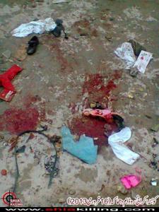 After the blast: Children's shoes and a doll on the blood-splattered road at Kirani Road, Quetta