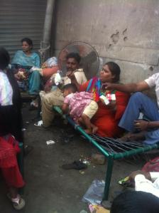 This family refuse a tent so they can squat in front of their home. Photo: Nadia Jamil