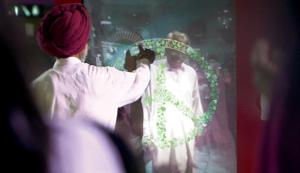 Tracing a peace sign together via a giant web-cam