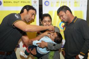 ‘Bowl out polio’: Pakistani cricketers Younis Khan and Imran Farhat give polio drops to a child at a UNICEF event in New Delhi, Jan 2013. Photo: PTI