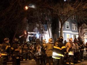 Firefighters tackle the blaze in the early hours of a freezing winter morning