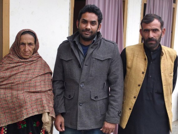 Shafqat's mother and brother in AJK with JPP investigator Yasir Shahbaz (centre). She must be in her 50s; looks about 90.