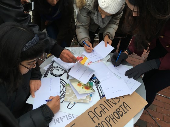 Signing cards for APS at Boston rally