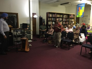 Animated discussion following the talk, at a well attended gathering (considering the holidays and beautiful day). Photo: Beena Sarwar