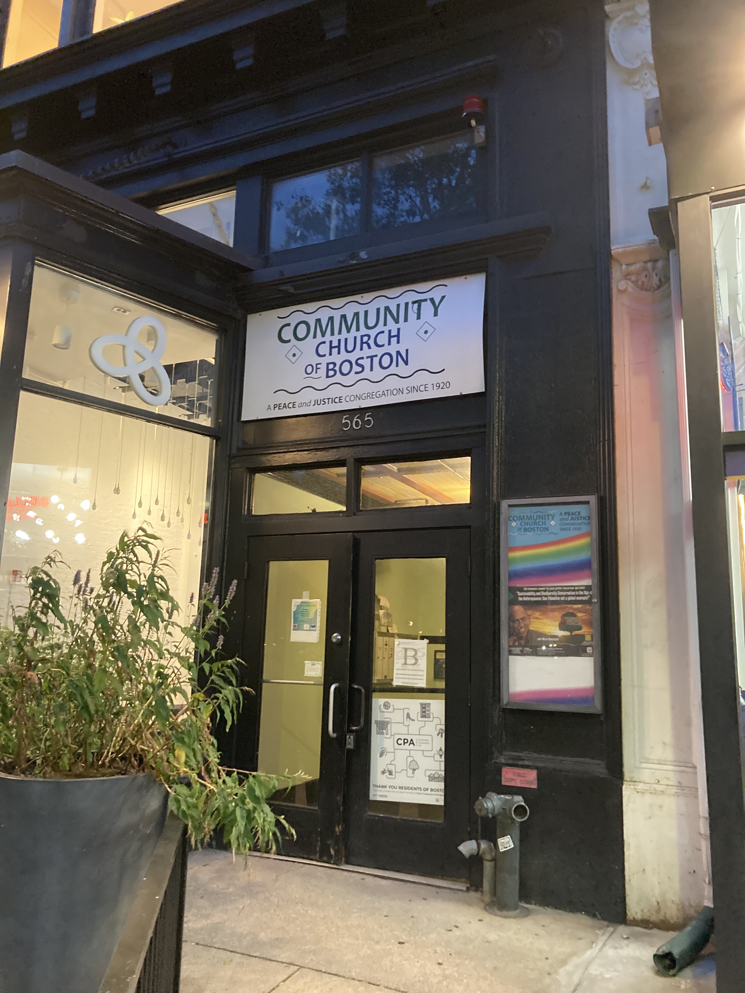 Photo - Entrance to the Community Church of Boston: A welcoming space nestled between a coffee and retail shops at Copley Square