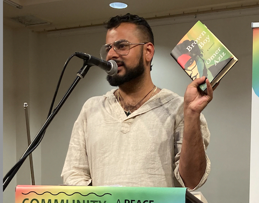 Kandeel showing Omar Aziz's book just-published book Brown Boy